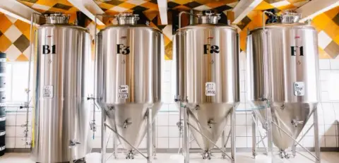 Fermentation tanks at the wood-fired Tête d'Allumette brewery