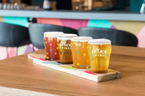 A tasting flight of The Office Brewery beers