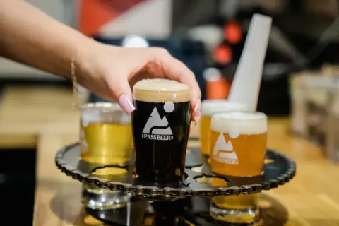 A flight of Pass Beer tasters on the bar