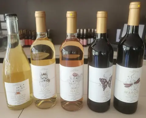 Five bottles of Lano d'or wines: Petnard, Lou, Nao, Ema and Margo