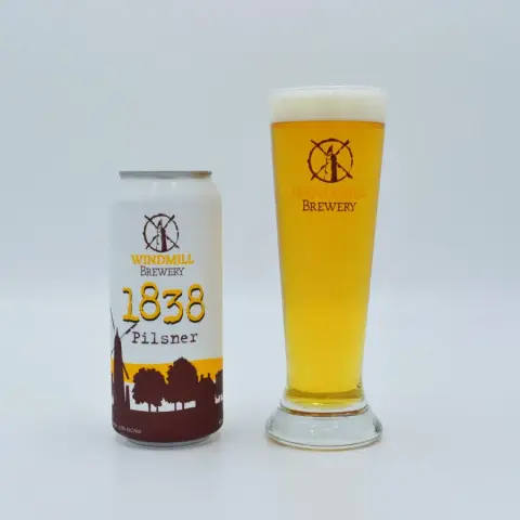 Can and glass of Windmill Brewery 1838 Pilsner