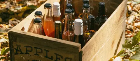 A wooden apple crate of Wooden Gate cider bottles