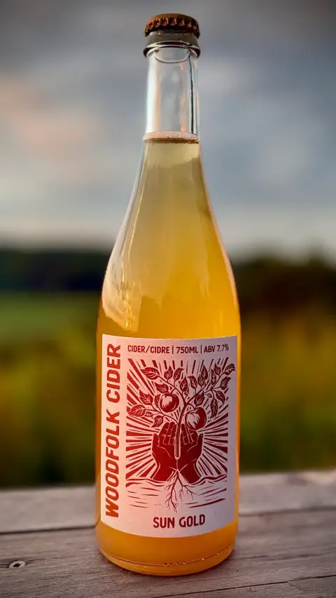 A bottle of Woodfolk Sun Gold cider, harvest 2025